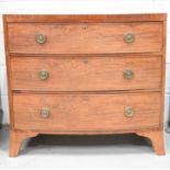 A Victorian bow fronted mahogany chest of three drawers.