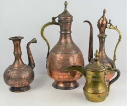 A group of 19th century and later Middle Eastern copper and brass ewers together with a water