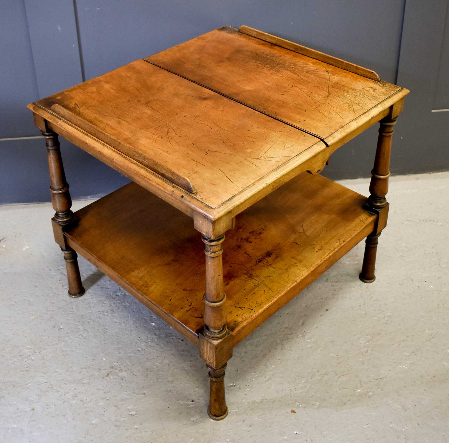 A 19th century mahogany book rest / table, the folding top having two removable book rest slides,