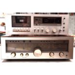 A vintage Luxman R-1050 solid state stereo receiver together with a Luxman k-5A stereo cassette