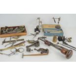 A group of clock repair / making tools to include a small precision lathe, pliers, miniature