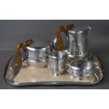 A mid century Piquot ware tea set and matching tray.