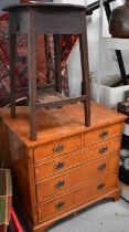 A 1940s cricket table together with a small reproduction chest of drawers raised on bracket feet.