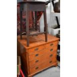 A 1940s cricket table together with a small reproduction chest of drawers raised on bracket feet.