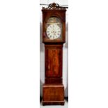 A fine 19th century mahogany longcase clock with an arched painted Roman numeral dial with