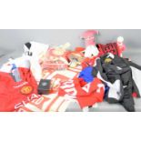 A collection of Manchester United Football memorabilia to include various shirts from the 90s,