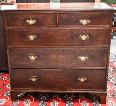 A 19th century oak chest of drawers, with two short over three long graduated drawers, raised on
