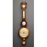 A late 19th century mahogany cased wheel barometer with boxwood stringing, 96cms tall