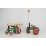A Mamod steam roller together with a Mamod steam tractor, no burners.
