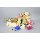 A group of vintage teddy bears and soft toys to include some straw filled examples.