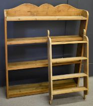 An antique pine wall shelf with shaped top, together with a smaller spice rack, the shelf measures