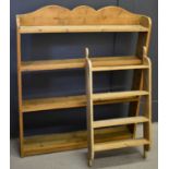 An antique pine wall shelf with shaped top, together with a smaller spice rack, the shelf measures