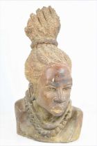 An African carved soapstone bust of a native women with braided hair, signed P.Mosh, 33.5cm high.