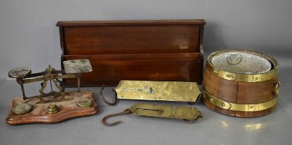 A Victorian mahogany letter rack, wooden and brass jardiniere, two antique brass hanging scales, and