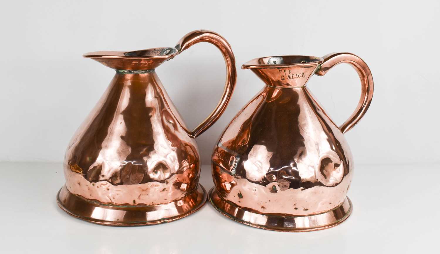 A pair of 19th century copper Gallon measures.