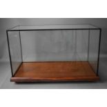 A glass and wooden model display case, 39cm by 60cm by 30cm