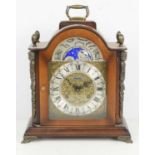 A Franz Hermie mahogany cased mantle clock, manual wind movement, moon phase, raised on bracket