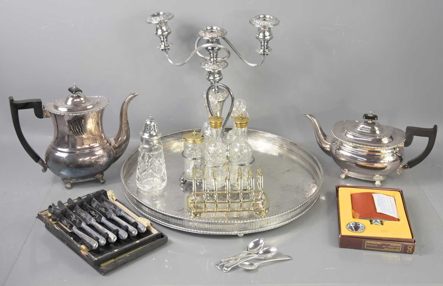 A group of silver plate and other items to include a large gallery tray, tea pot, candelabra,