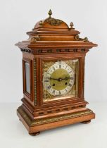 A mahogany cased bracket clock, with domed top above a bevelled glass doors enclosing a silvered