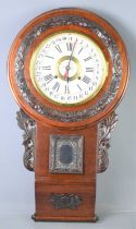 An early 20th century mahogany cased Seikosha regulator calendar wall clock, the case with carved