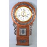 An early 20th century mahogany cased Seikosha regulator calendar wall clock, the case with carved