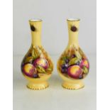 A pair of Aynsley vases, painted with fruit on a cream ground.