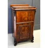 A 19th century mahogany music cabinet, the top section lifting up above a panelled flame mahogany