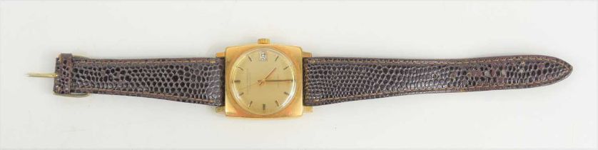 A vintage Girard-Perregaux gyromatic gents wristwatch with a gold plated case and brown leather