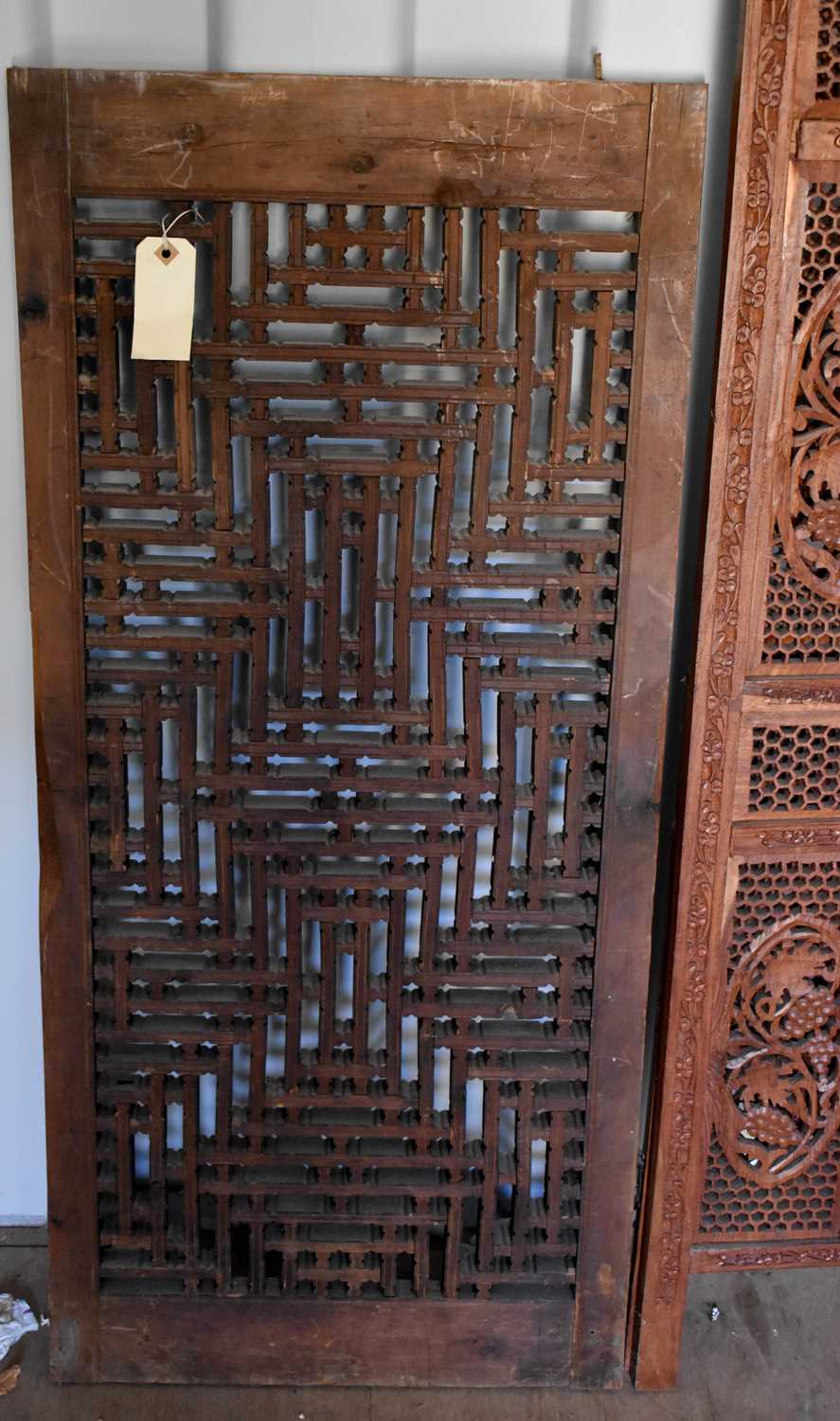 A bi-fold Indonesian hardwood carved screen, together with a carved panel, the screen measures 182cm - Bild 2 aus 2