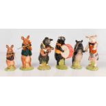 A group of Beswick pottery musical pigs, including guitarist, drummer, flautist and others. (6)