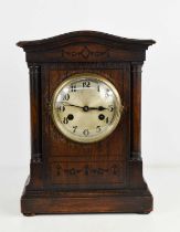 A 1940s oak cased mantle clock, with Arabic dial, 34cms tall