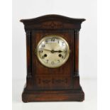 A 1940s oak cased mantle clock, with Arabic dial, 34cms tall