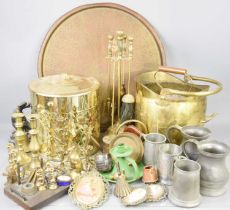 A quantity of pewter and brassware to include coal scuttle, tankards and a pair ofcandlesticks.