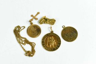 A group of 9ct gold, to include three Saint Christopher pendants, a motorbike charm A/F, and a