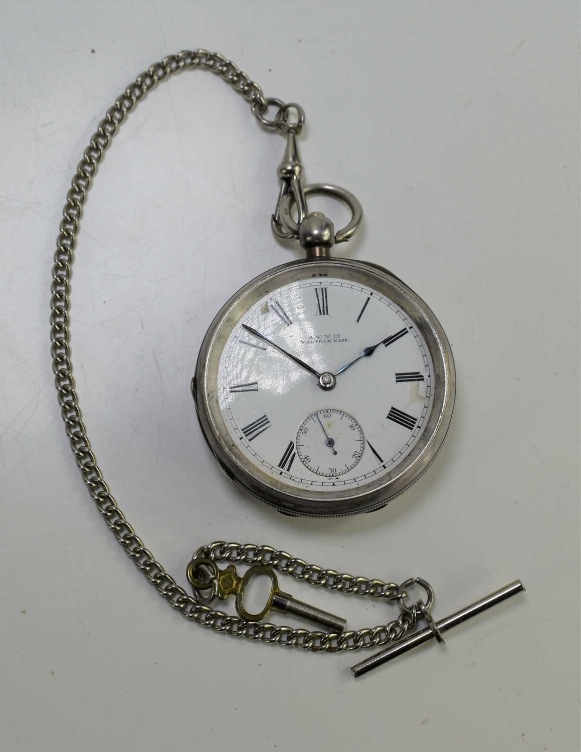 A silver American Waltham Watch Co pocket watch with a silver plate Albert chain.