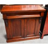 A Victorian mahogany sideboard, with frieze drawer above two panelled doors, 85cm high by 89cm