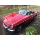 A red vintage MG B Sports, 1840cc, petrol, 2 Axle-Rigid body, registration number DGW 544H, 31,540