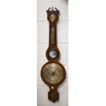 A late 19th century mahogany cased wheel barometer, 94cms tall