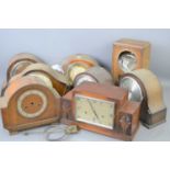 A group of eight oak cased mantle clocks to include examples by Smiths, a/f.