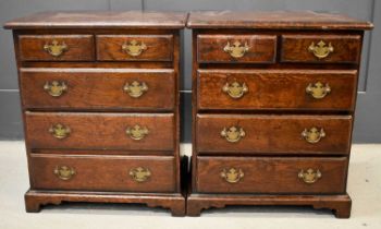 A pair of 18th century style oak chests / bedside cabinets, of small proportions, with two short