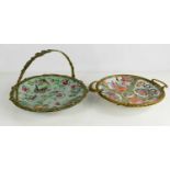A Chinese canton dish in a brass basket form frame, together with a famille rose dish in metal
