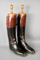 A pair of antique boot trees together with pair of leather gentleman's boots.