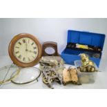 A group of clock spares and some tools to include, a hook and spike wall clock, movements, dials and