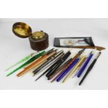 A collection of fountain pens, of various style and form, including glass examples, together with