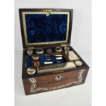 A 19th century rosewood and mother of pearl vanity case, the blue velvet lined and fitted interior