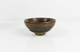 A Chinese stoneware rice bowl, with graduated dark grey/green and brown glaze.