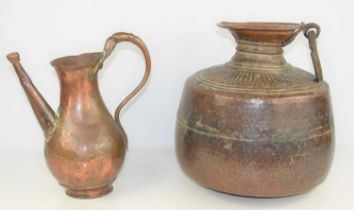 A 19th century Indian Mughal hammered copper water storage pot, 31cm high together with a copper