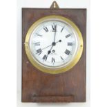 A 20th century Smiths brass cased bulkhead clock with a single train eight-day movement, 19cms
