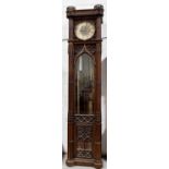 An impressive Gothic revival Victorian clock, the silvered circular dial having gilt brass Gothic
