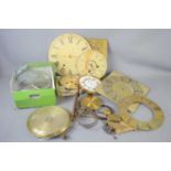 A group of clock spares to include an 18th century brass clock face signed WM Tonnly, a brass